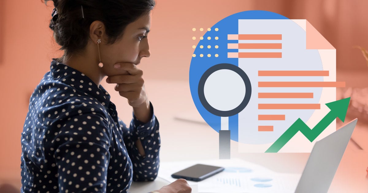 Woman sitting at laptop contemplating whether she should hire an outsourced credit control service