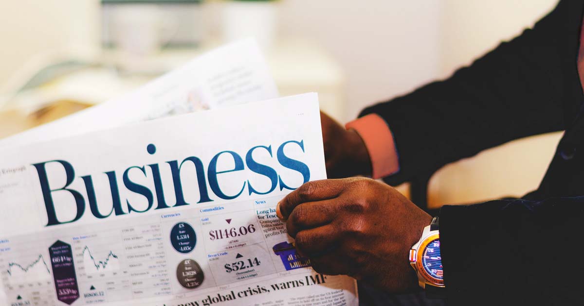 Reading business newspaper