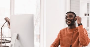 Sales rep at a computer desk
