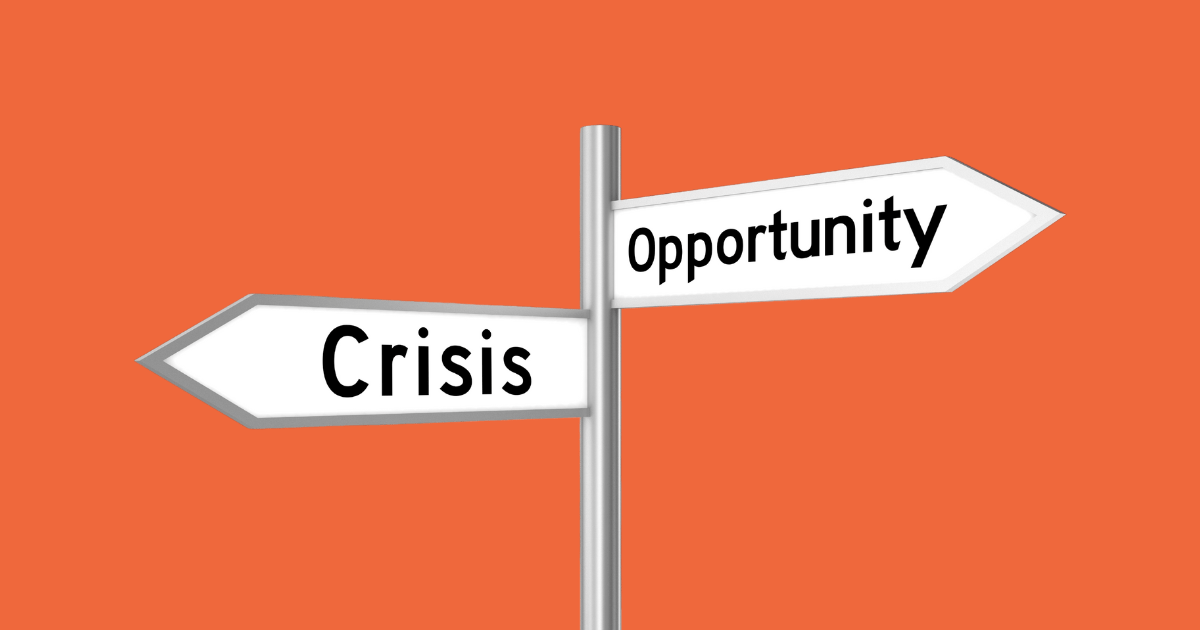 orange background with 2 arrows going opposite directions, 1 for crisis and 1 for opportunity.