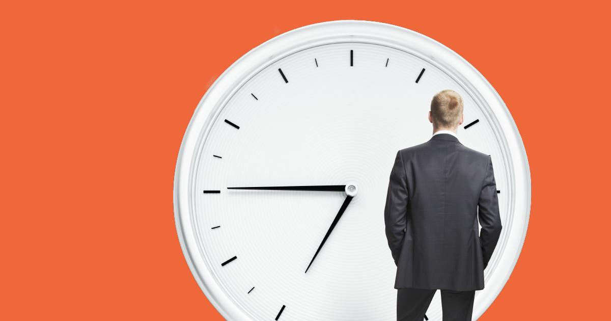 person looking at giant clock with orange background