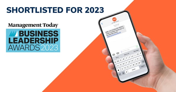 management today shortlist banner and hand holding phone with sms payment reminder on