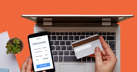 client holding card to make online payment