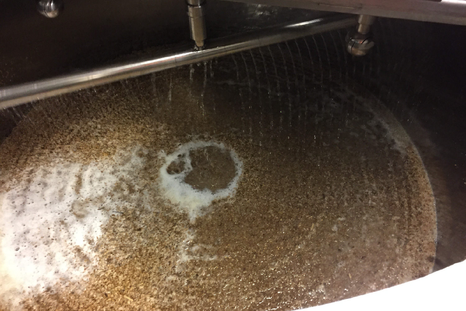 A look inside the vat of a beer brew after mashing