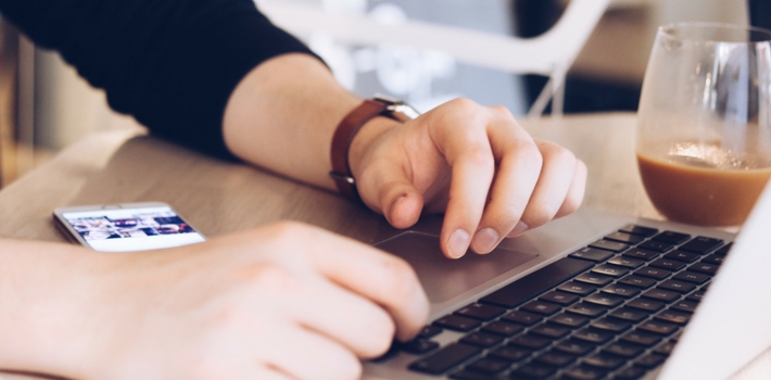 Hands on a laptop keyboard